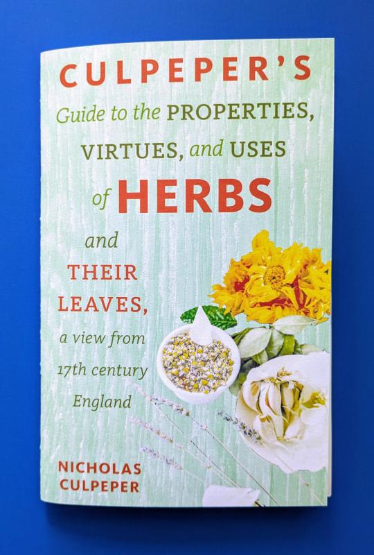 Light green cover with red and green text, photos of common herbs.