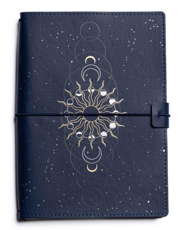 a leatherbound journal with celestial imagery on the cover