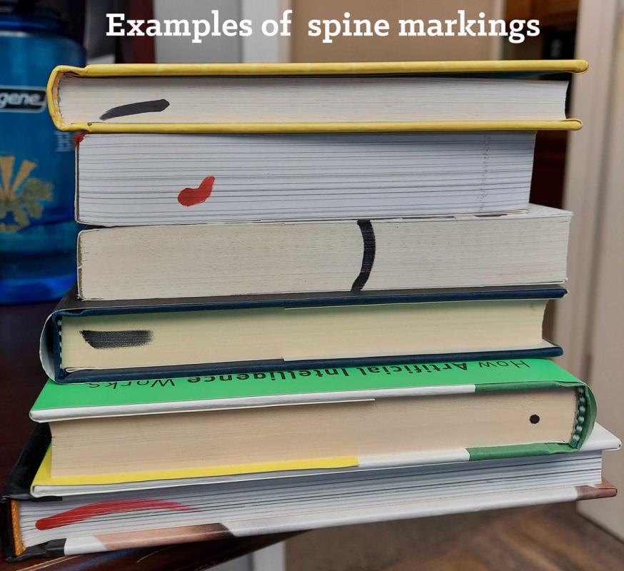 Stack of remainder books with markings.