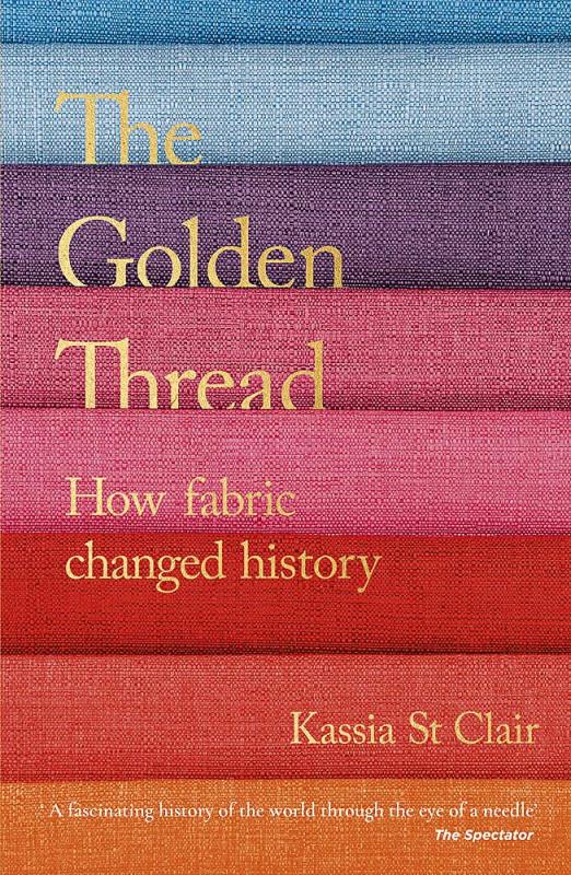 Strips of multi-colored fabric as a background against golden text.