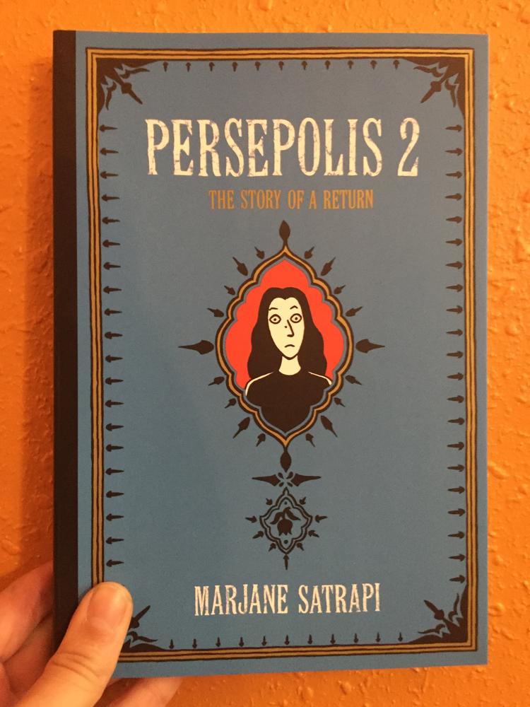 Blue cover with cartoon portrait of Marjane Satrapi