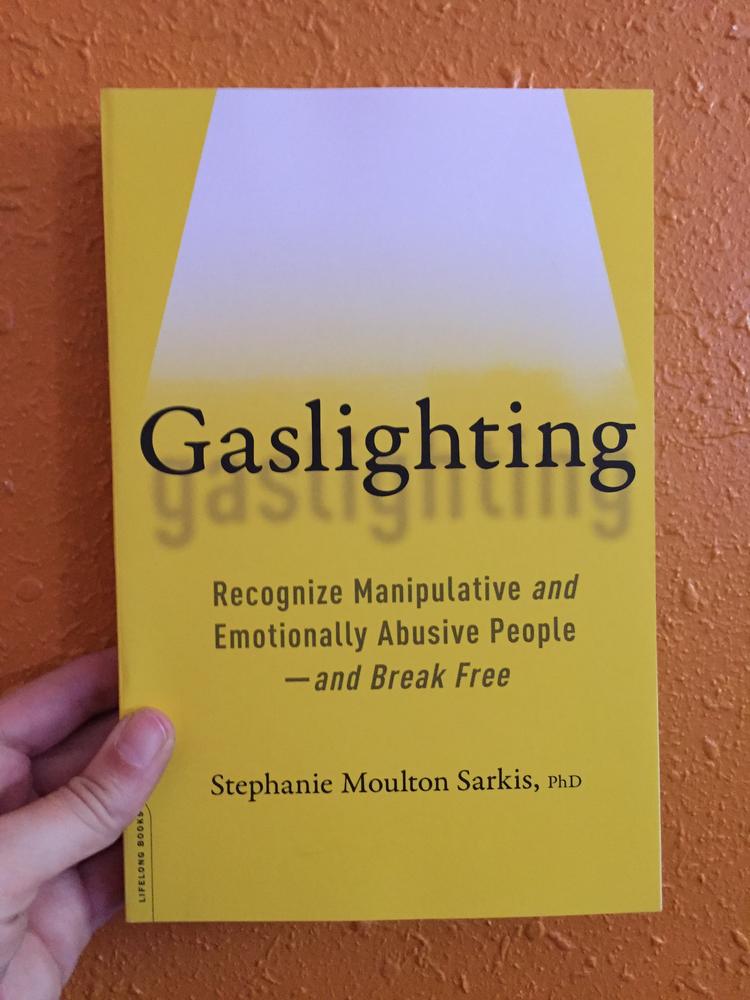 Yellow cover with a spotlight over the title