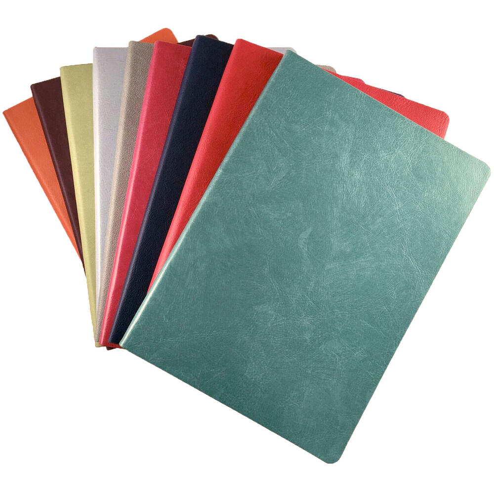 a stack of multicolored blank journals
