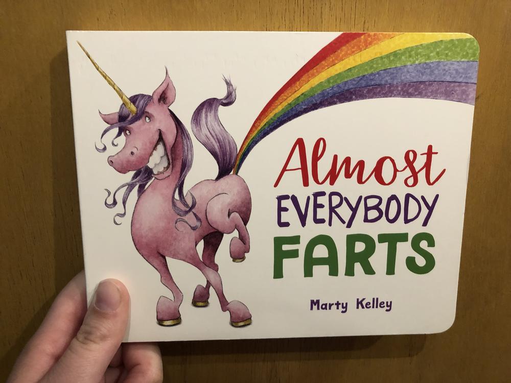 A pink and purple unicorn farting a rainbow. Board Book.