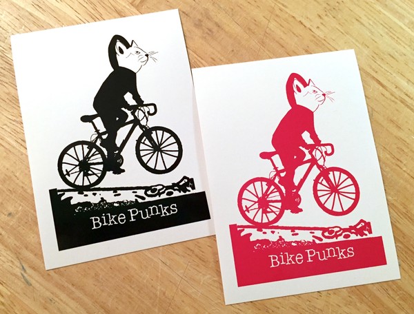 drawing of a cat riding a bike and the words "bike punks"