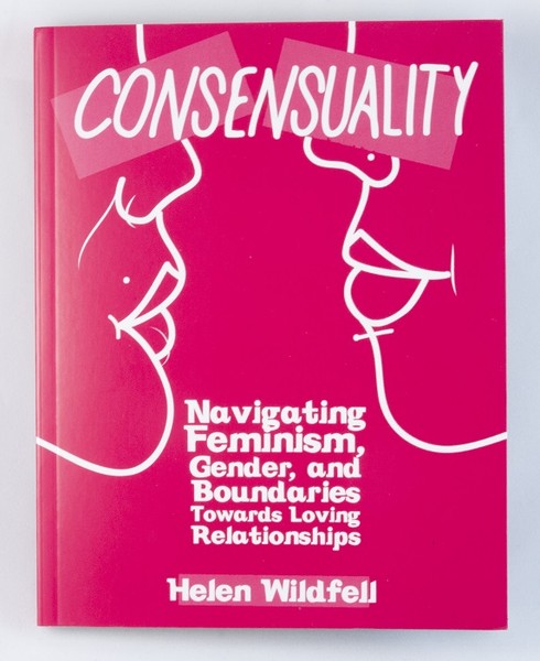 A pink book with the outlines of two women's faces facing one another