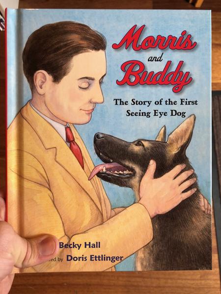 Book cover featuring illustration of a man in a suit petting a dog.