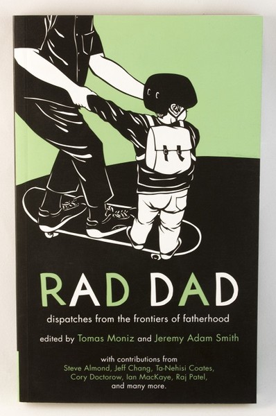 A zine cover with an image of a child holding their dad's hands, both on a skateboard