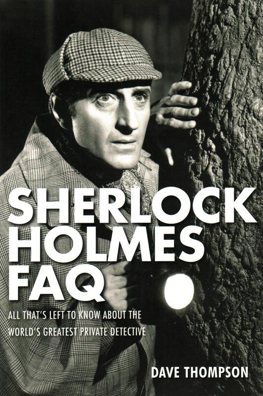A black-and-white closeup of Basil Rathbone playing Sherlock Holmes.