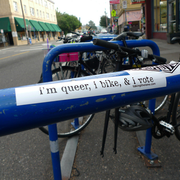 "i'm queer, i bike, and i vote" sticker