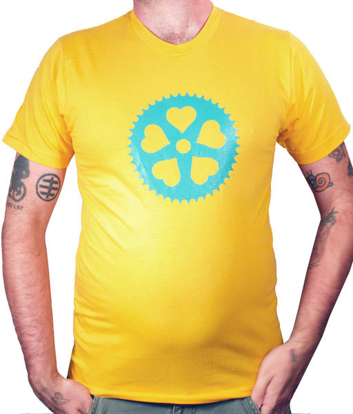 a photo of a man wearing a yellow t-shirt with a blue chainring printed on it