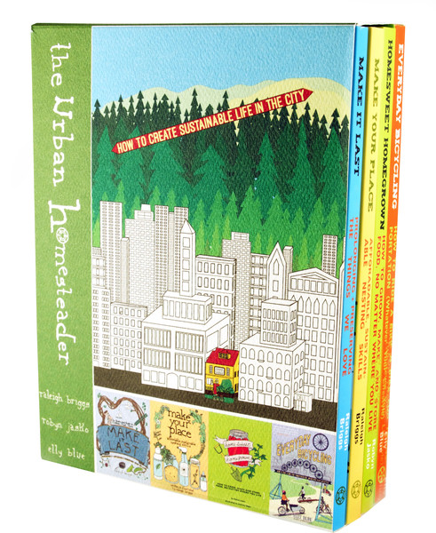a box set of books with an illustration of a city surrounded by trees (Portland)