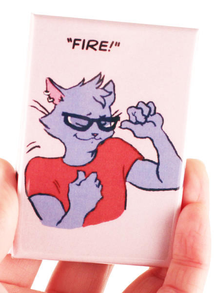 a photo of a magnet with a drawing of a cat flexing their bicep and the word "Fire!"