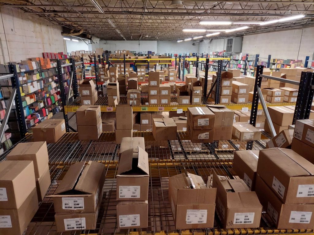 a warehouse full of pallet racking and boxes