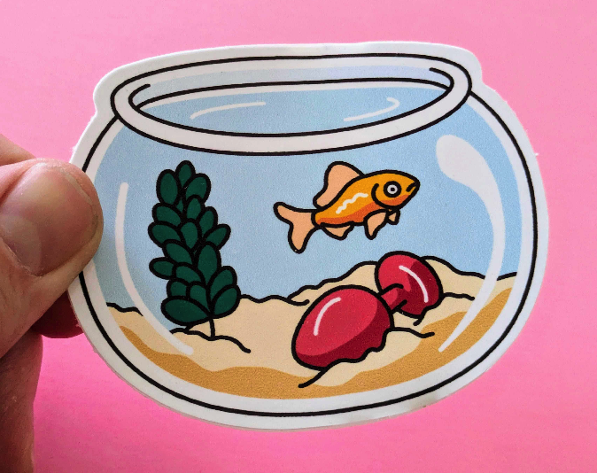 A gold fish in a bowl, with a butt plug as decor