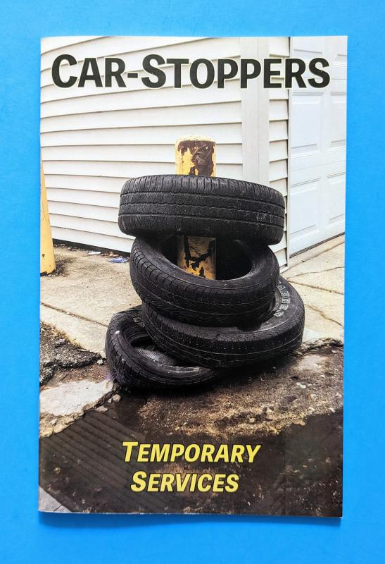 a photograph of four tires around a post