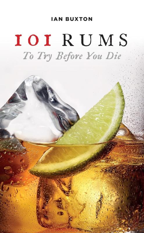closeup shot of rum on the rocks with a citrus wedge