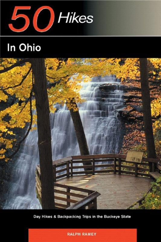 Cover with photo of a waterfall behind a tree with yellow fall leaves
