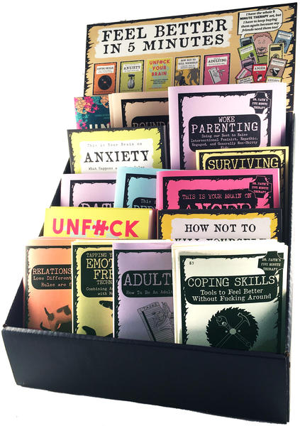A large collection of therapy zines in a display box