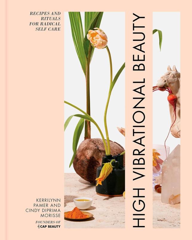 A light peach book cover featuring a photograph of tropical plants.