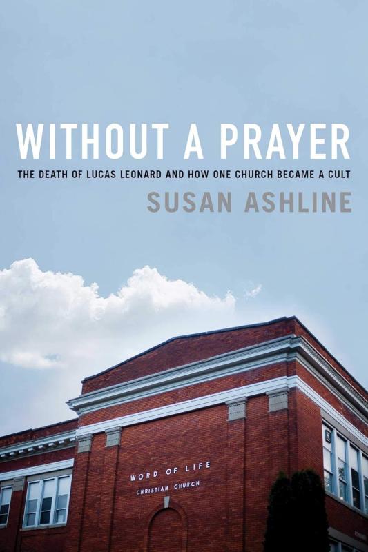 blue cover with white text showing a red brick building at the bottom