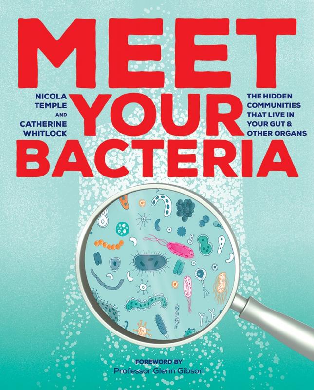 Cover with image of magnifying glass focused on bacteria