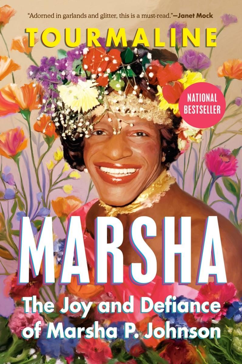 Marsha surrounded by flowers