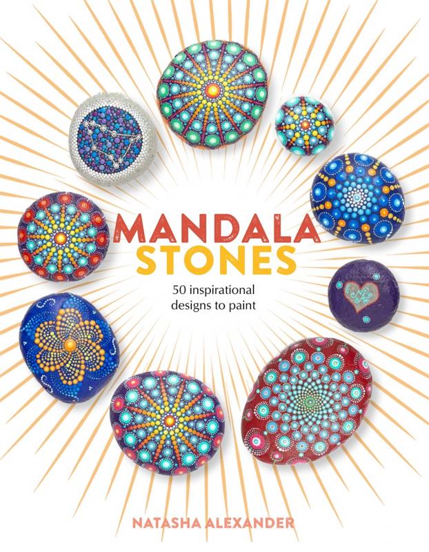 a circle of colorfully painted stones with yellow lines radiating out from the center