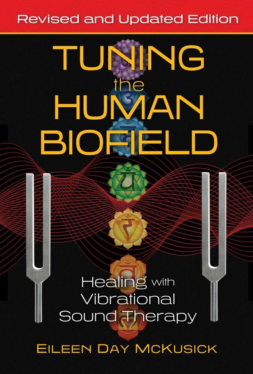 black cover with tuning fork with yellow text and illustration of chakra symbols