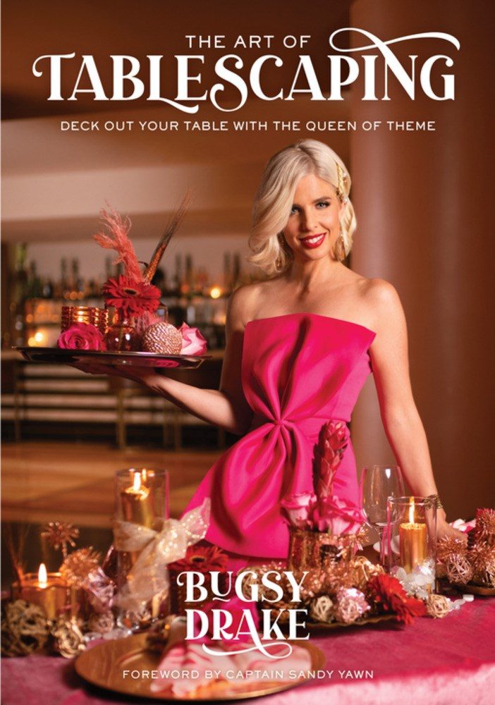 fancy dress woman next to a table full of decorations