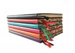 a stack of blank journals with floral trims