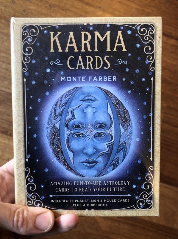 Hand holding Karma Cards