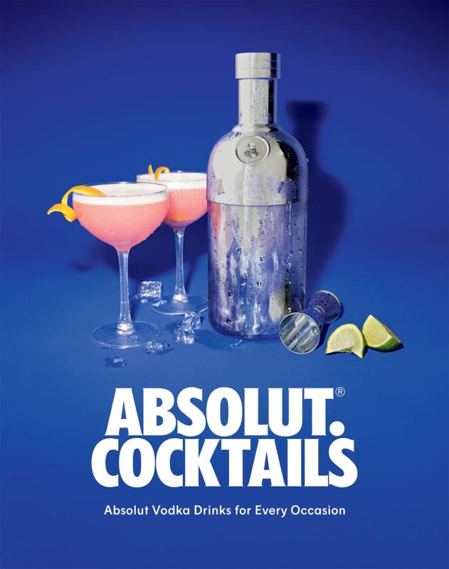 Frosty bottle next to two martini glasses with orange rind and pink drink, a mixing cup, citrus wedges, and some melting ice over a blue background