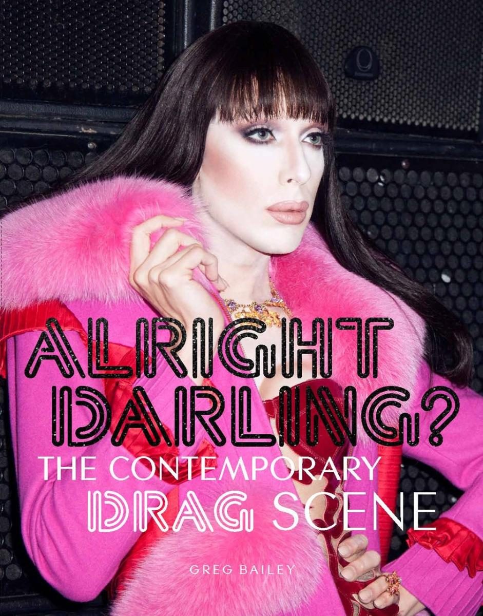 Drag queen in a glamorous pink coat