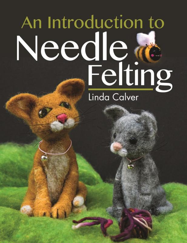 felt pets over a dark background