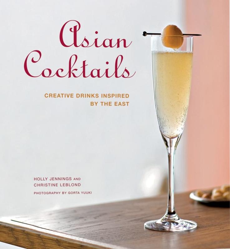 libation flute with a bubbly drink with a hanging skewered fruit