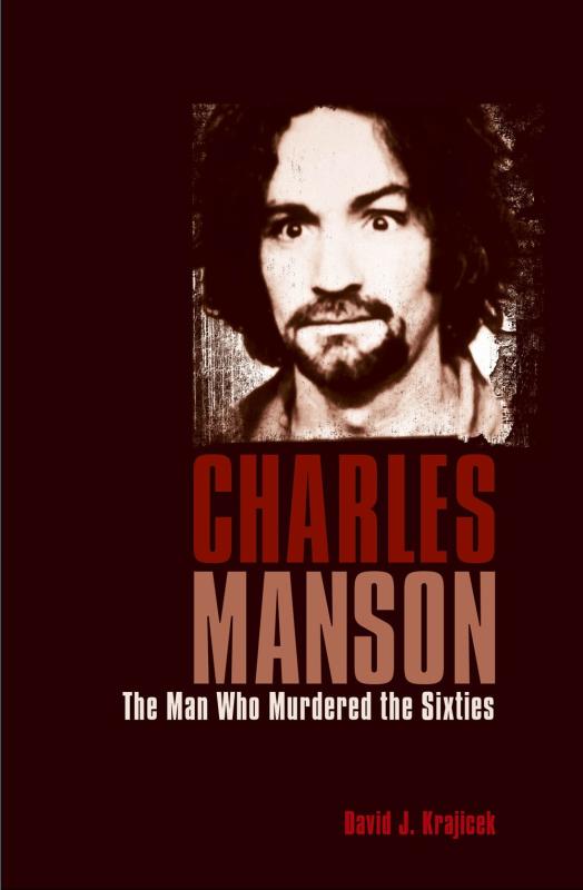 portrait of Manson in black and white over a black background
