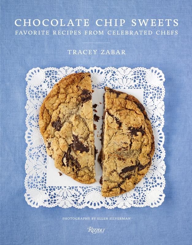 cookie cut in half over a doily over a blue background