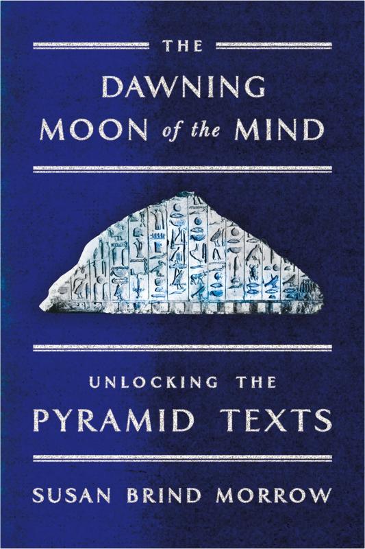 white stone with hieroglyphs over a blue and black background 