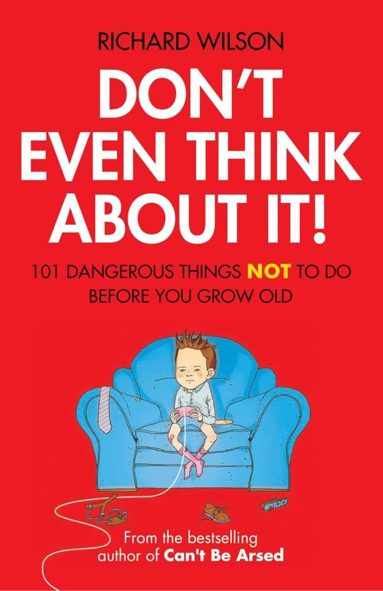 red background with a kid sitting holding a game controller on a blue couch