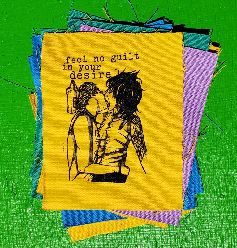 patch with two people kissing and the words feel no guilt in your desire