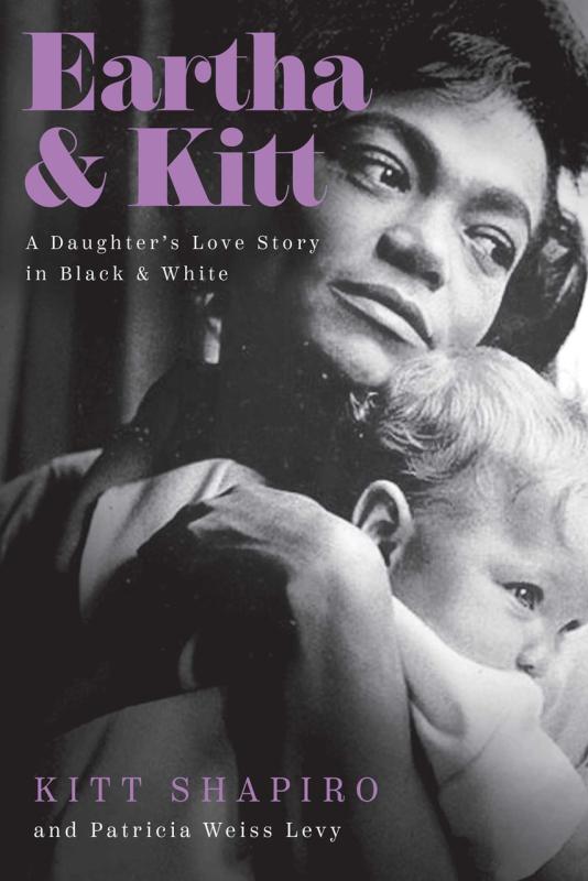 woman holding a baby in black and white