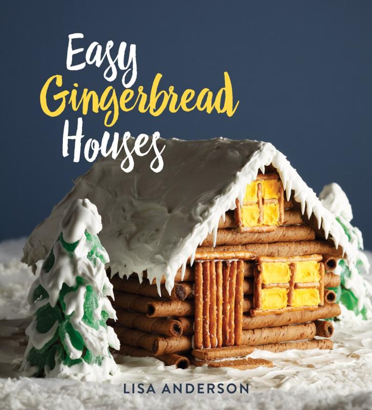Lots of snowy icing on a cozy looking log gingerbread house