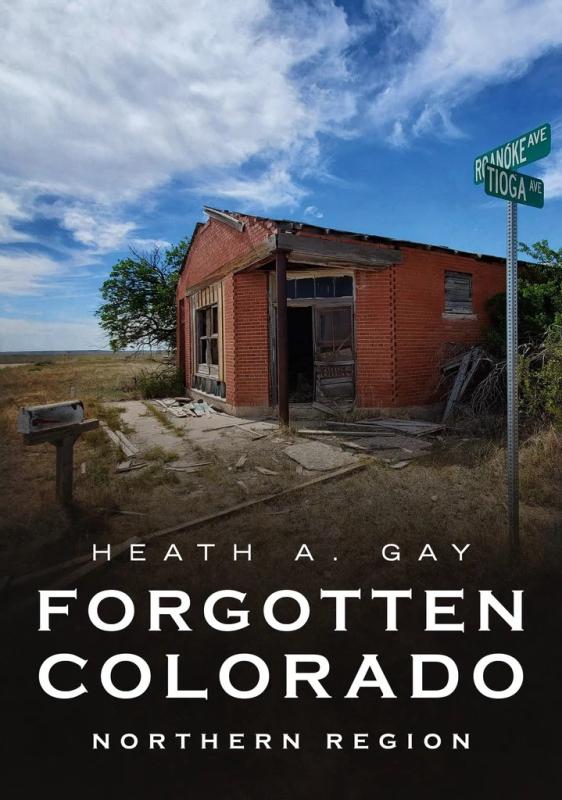 abandoned red brick building under a cloudy blue sky