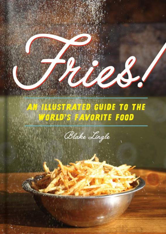 Metal bowl with french fries being sprinkled with salt