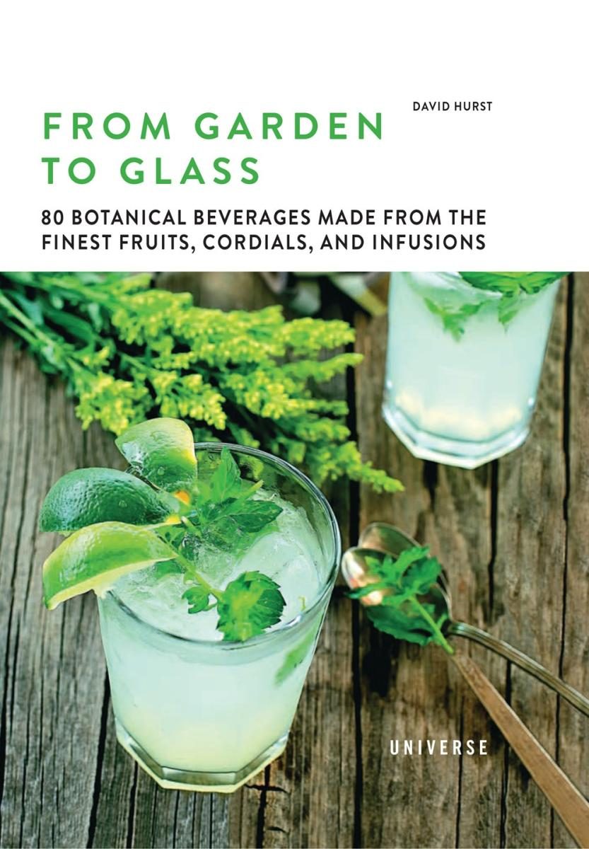 angled near-top-down view of a couple drinks on a table with botanicals