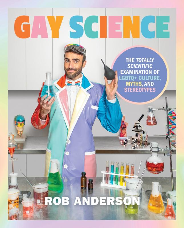 person in a colorful suit surrounded by beakers and test tubes and other science equipment