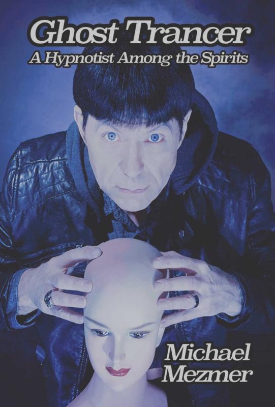 man looks at the camera straight on while holding a mannequin head in his fingertips