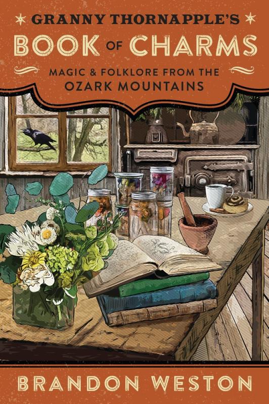 cottage kitchen table with books, flowers, jars, with a crow perched in the window