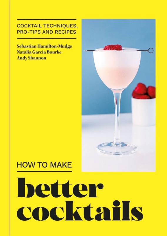 raspberries in a cocktail glass with the rest of the cover in yellow